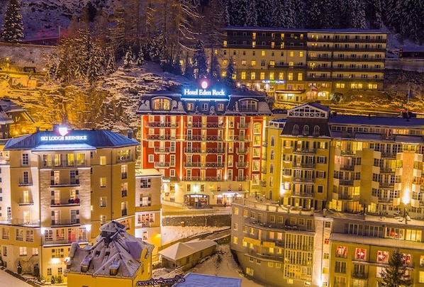 Hotel Eden Rock with multiple floors, balconies, and a ski lodge nearby.