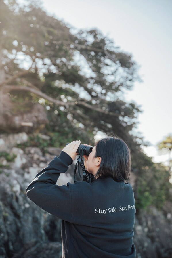 A person taking a photo with a camera.