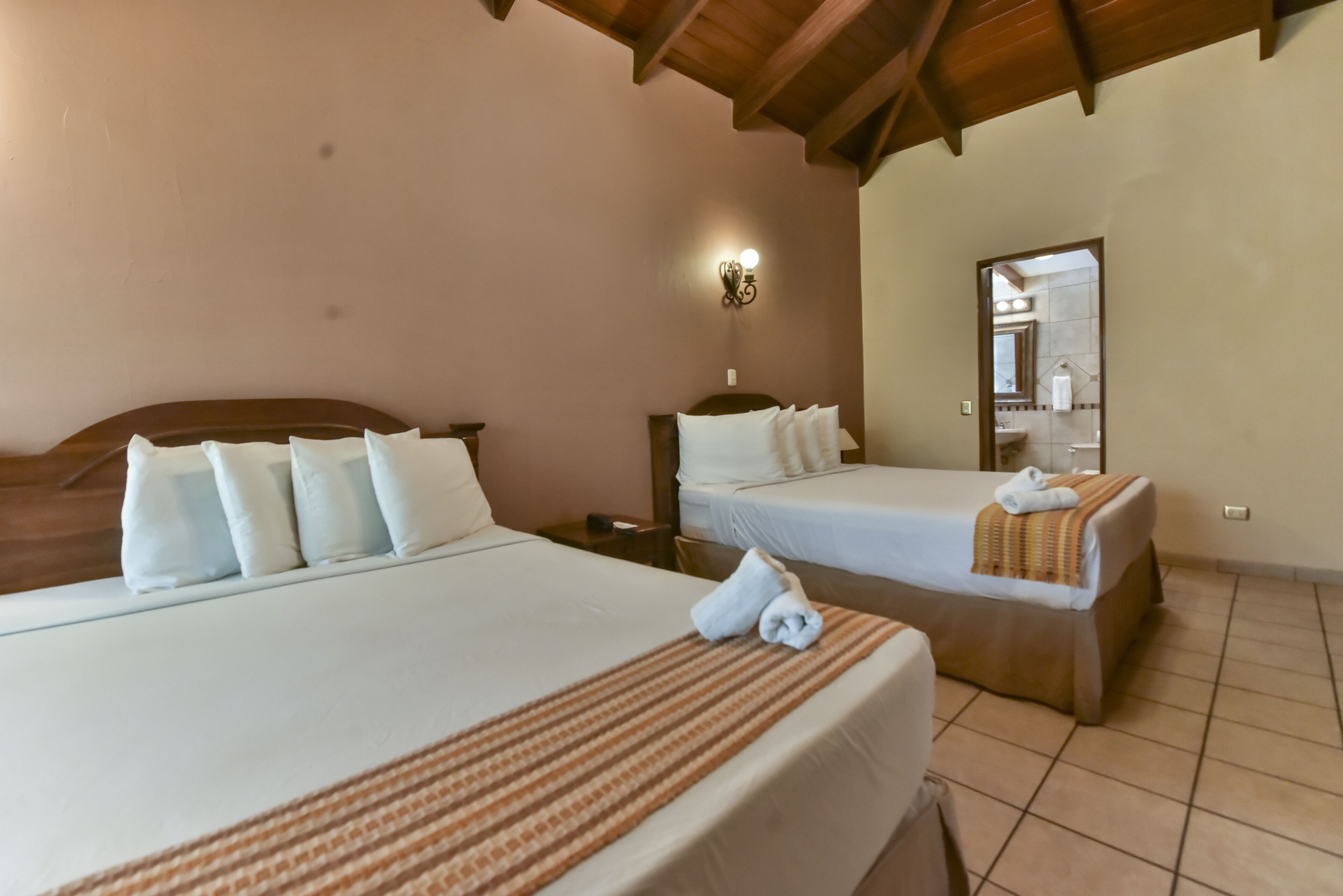 superior quadruple room, 2 queen beds | 1 bedroom, in-room safe, laptop workspace, blackout curtains