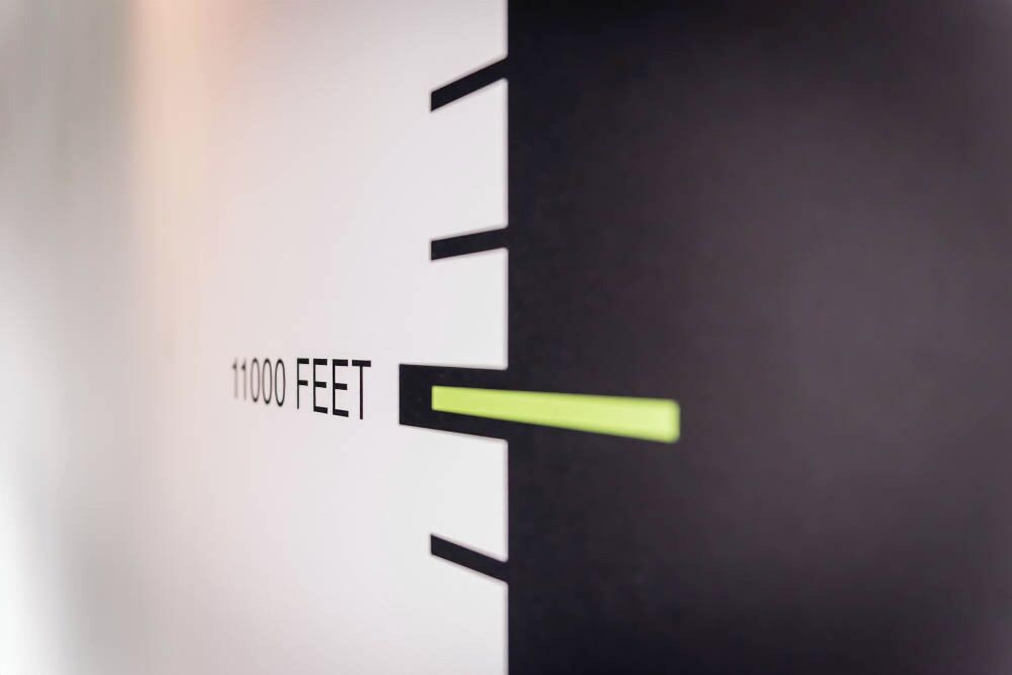A scale with '11000 FEET' marked on it.