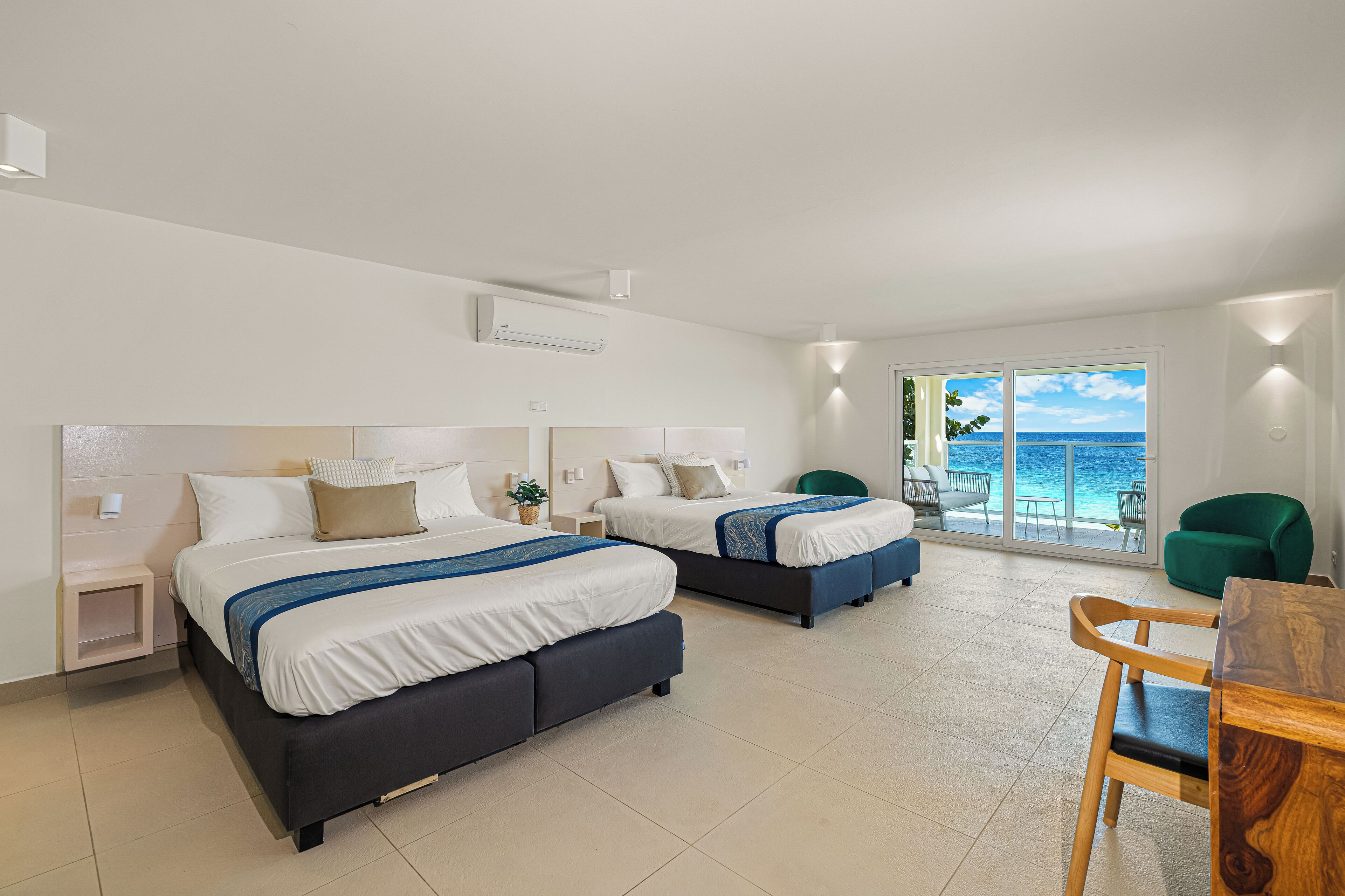 deluxe quadruple room | 1 bedroom, premium bedding, in-room safe, blackout curtains