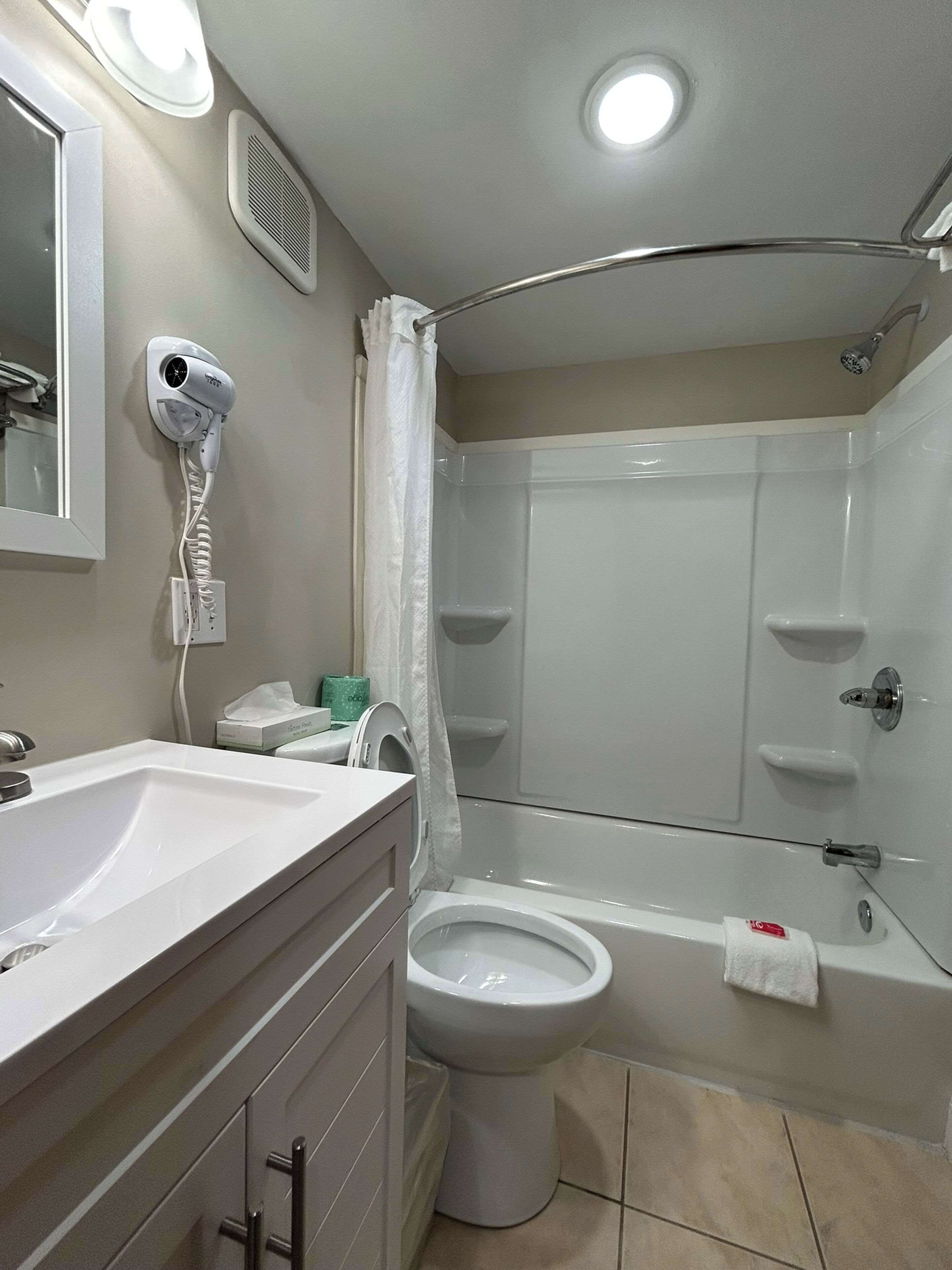 suite, multiple beds, non smoking | bathroom | combined shower/bathtub, hair dryer, towels