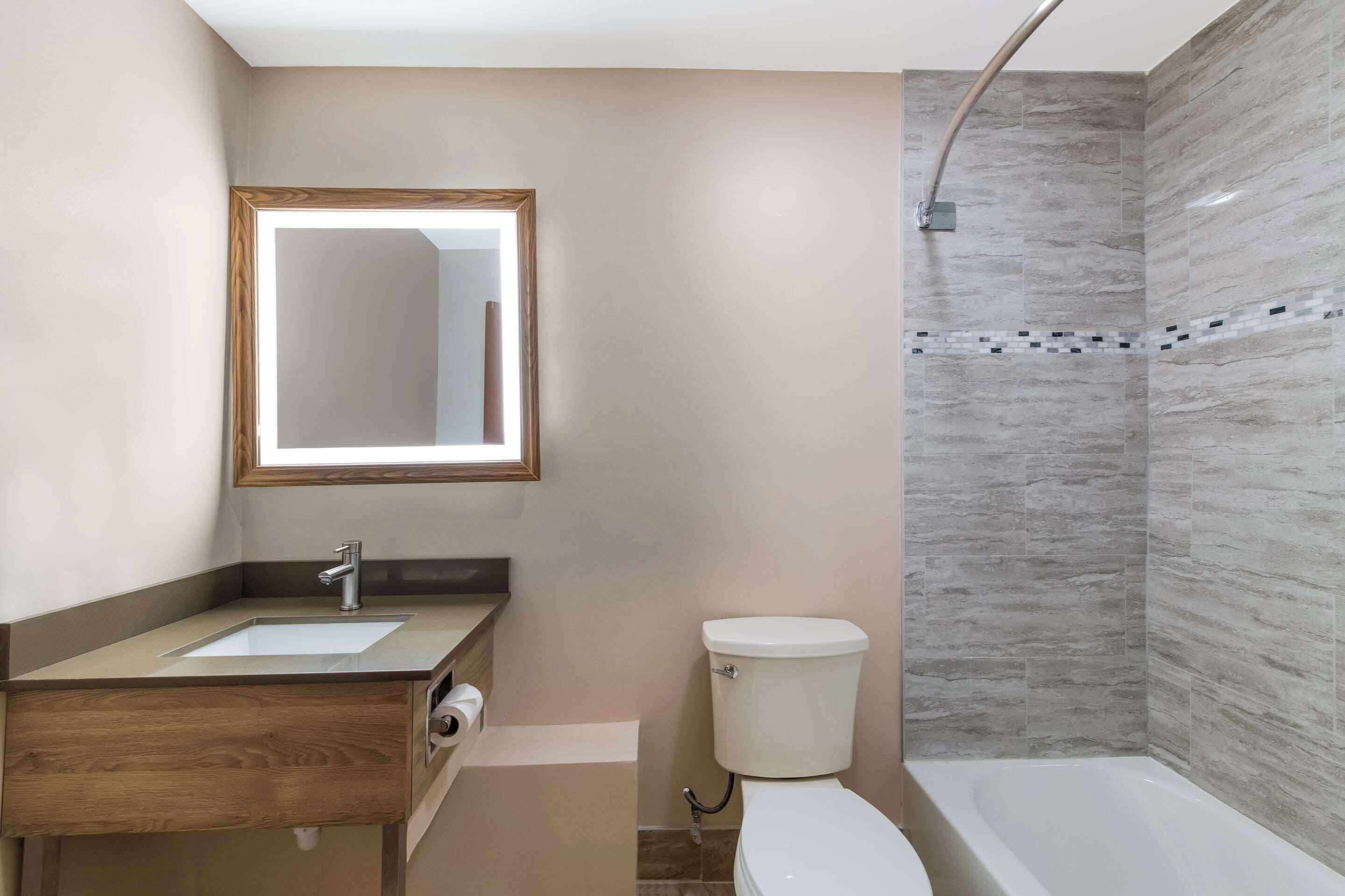 suite, multiple beds, non smoking | bathroom | combined shower/bathtub, hair dryer, towels