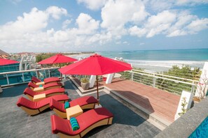 Outdoor pool, pool umbrellas, sun loungers