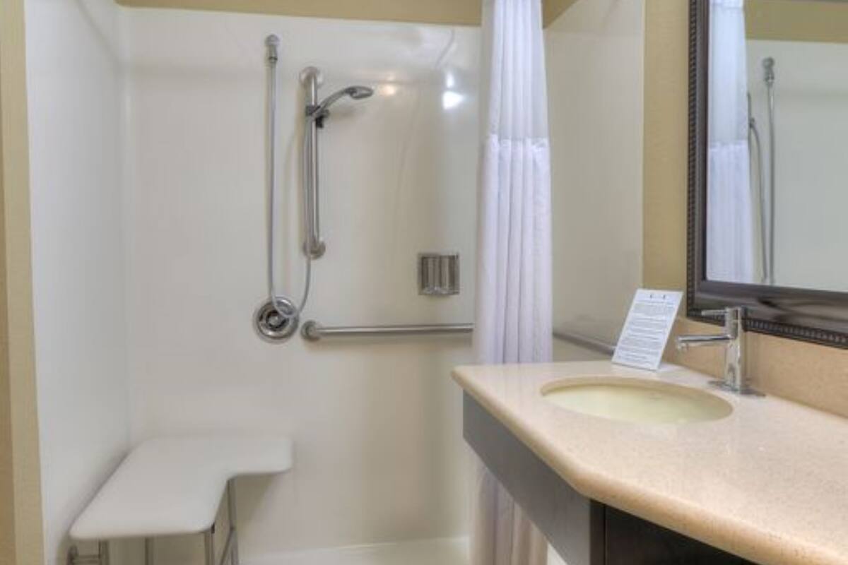 suite, 1 bedroom, accessible, kitchen (mobility, roll-in shower) | bathroom | free toiletries, hair dryer, towels