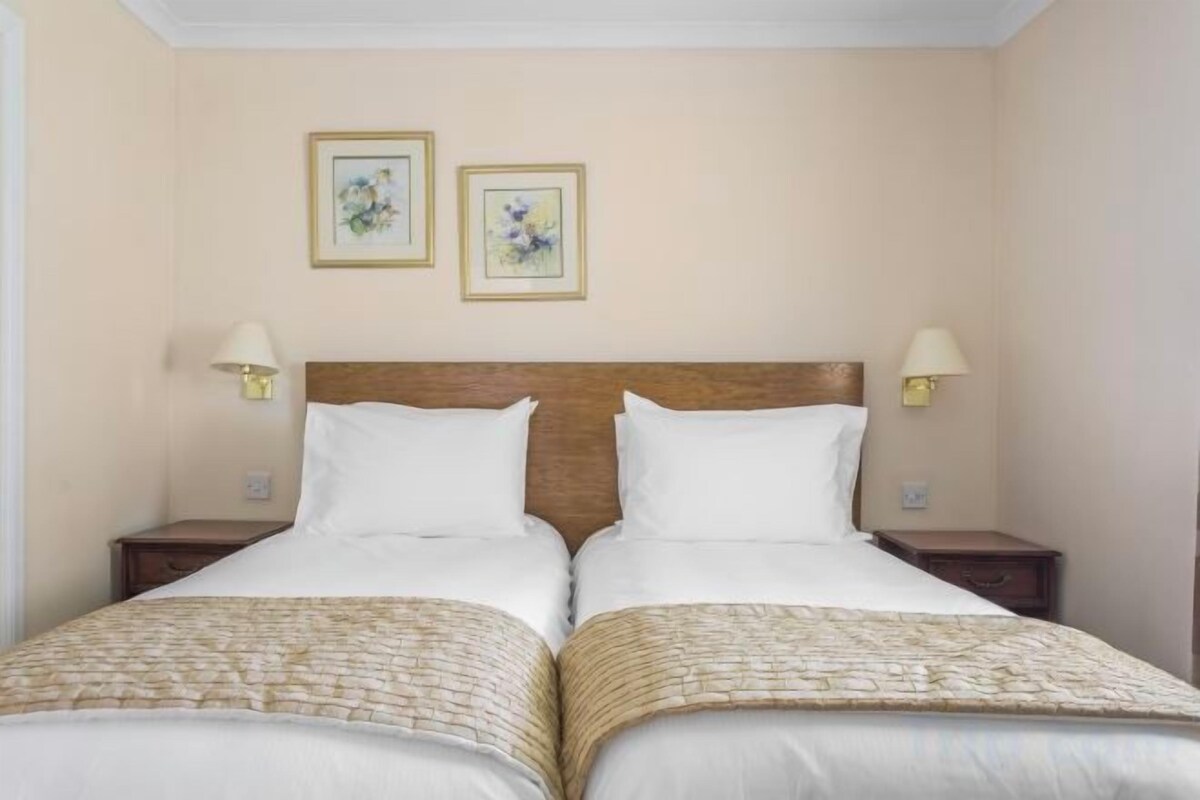 Iron/ironing board, cribs (free), WiFi (free), bed sheets