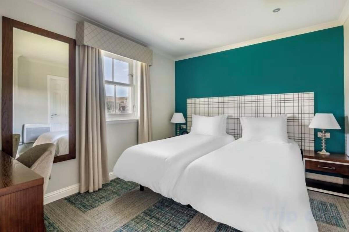 Iron/ironing board, cribs (free), WiFi (free), bed sheets