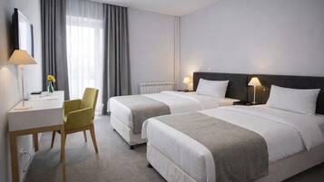 Standard Double or Twin Room | Minibar, in-room safe, desk, laptop workspace