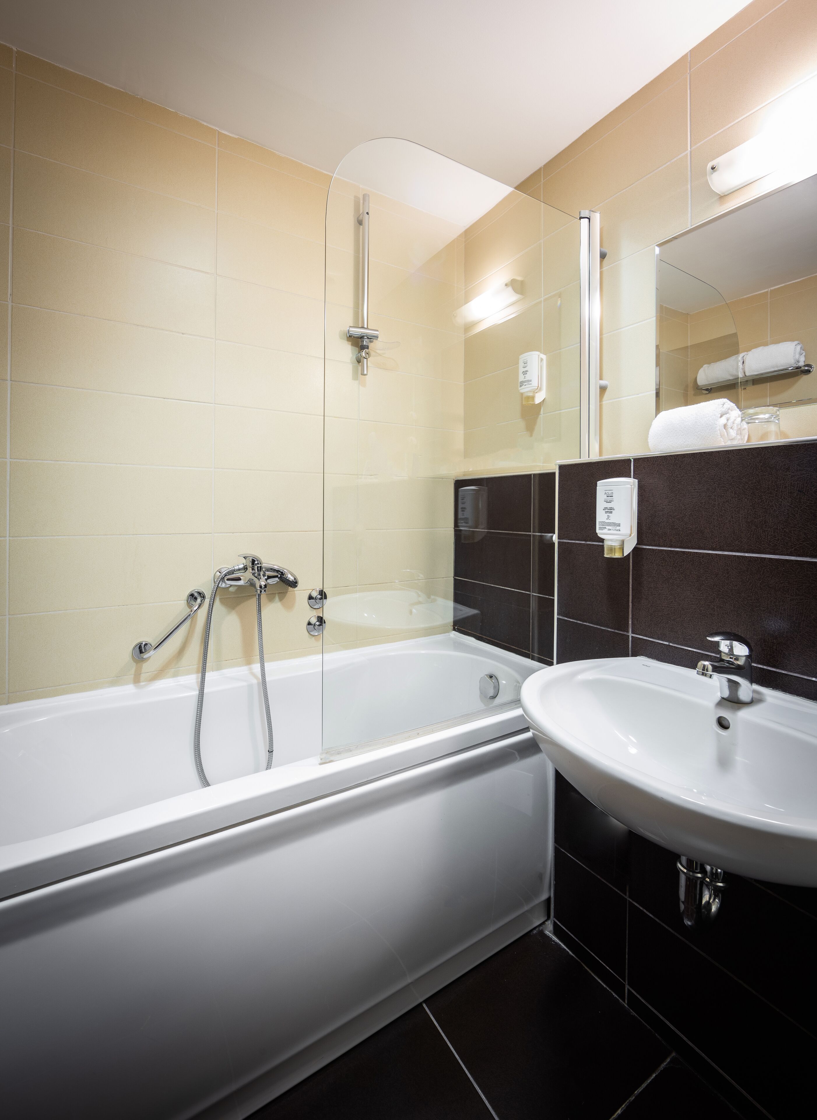 bathtub, free toiletries, hair dryer, slippers