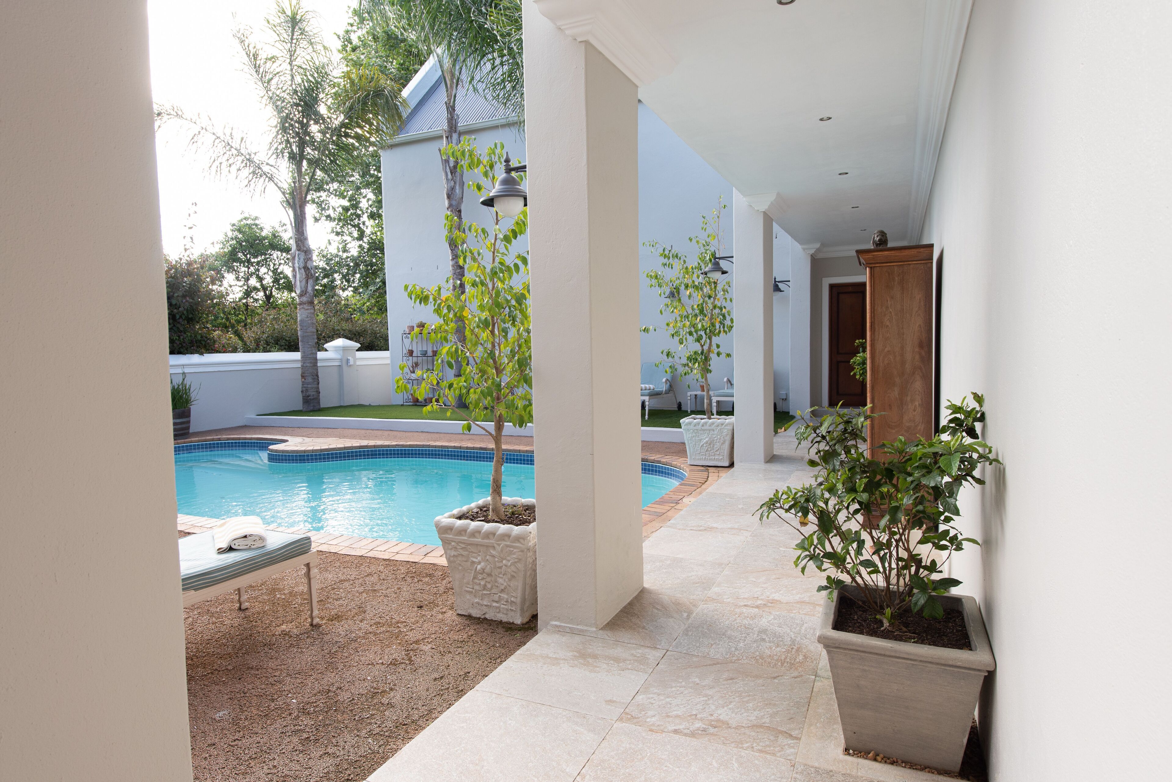 Outdoor pool, open 6:00 AM to 9:30 PM, pool loungers