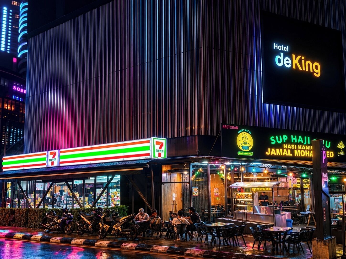 A 7-Eleven store, a restaurant named 'SUP HAJI,' and a 'Hotel deKing' sign.
