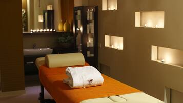 Experience ultimate relaxation with a soothing massage table, plush towels, and calming ambiance.
