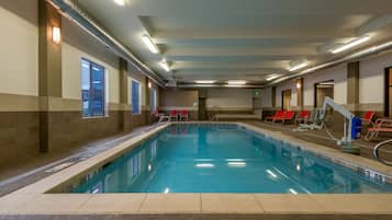 Relax by the pool surrounded by a spacious deck and comfortable lounge chairs.