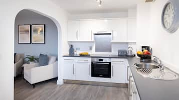 Two Bedroom Apartment (Sofa Bed) | Private kitchen | Full-sized fridge, microwave, stovetop, dishwasher