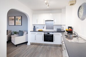 Two Bedroom Apartment (Sofa Bed) | Private kitchen | Full-size fridge, microwave, oven, stovetop - SACO Jersey Merlin House (St. Helier)