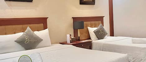 Family Triple Room | Minibar, desk, laptop workspace, soundproofing