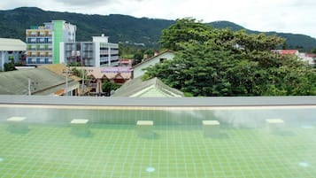 Outdoor pool, open 7:00 AM to 6:00 PM, pool loungers