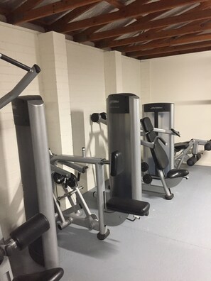 Stay fit on your vacation with our fully equipped gym featuring weight machines and free weights.