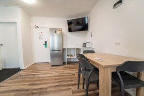 Family Room (1 Queen, 2 Singles) | Desk, laptop workspace, iron/ironing board, free WiFi