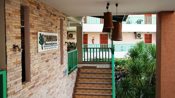 A brick building with a sign reading "TAMARIND RESIDENCES." - Tamarind Residences (Khon Kaen)