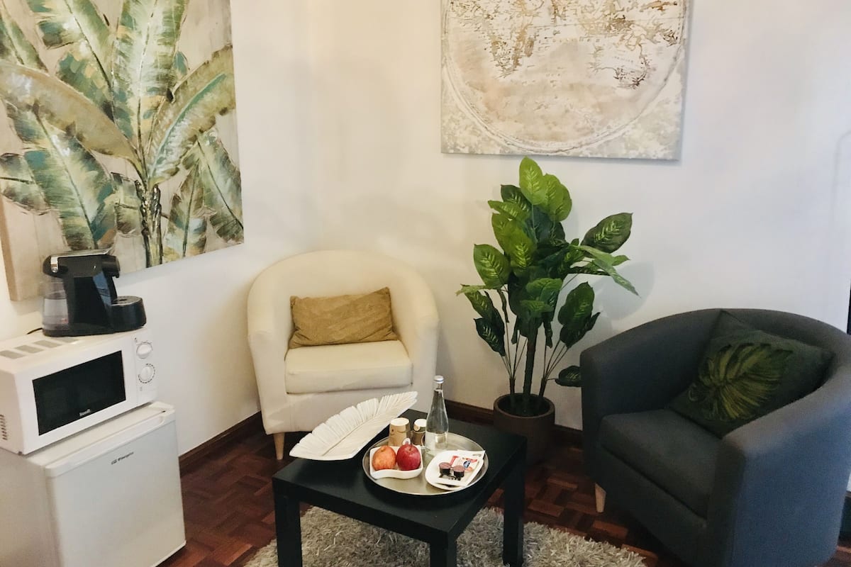 superior double room (with private bathroom) | living area | flat-screen tv