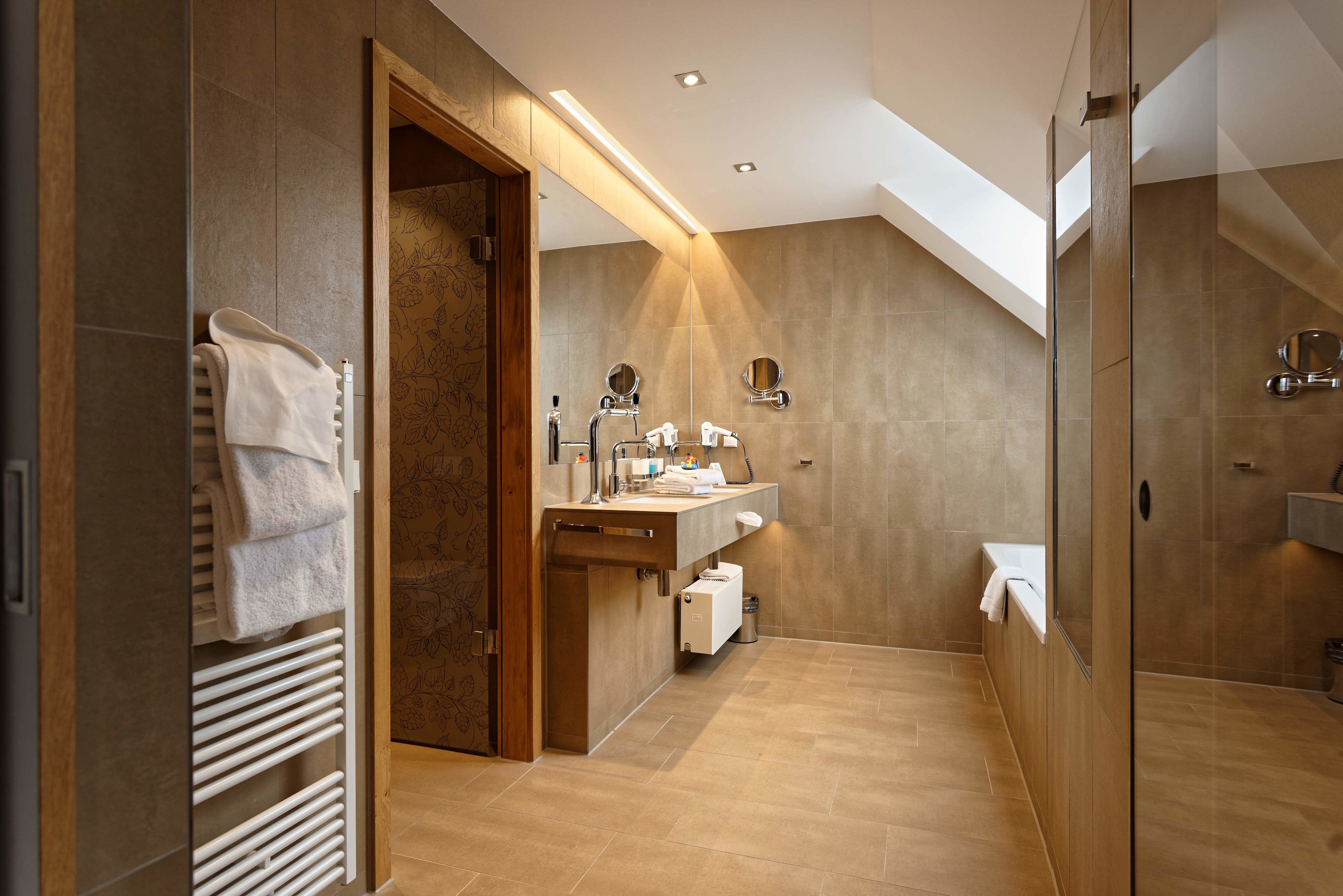 junior suite | bathroom | eco-friendly toiletries, hair dryer, towels