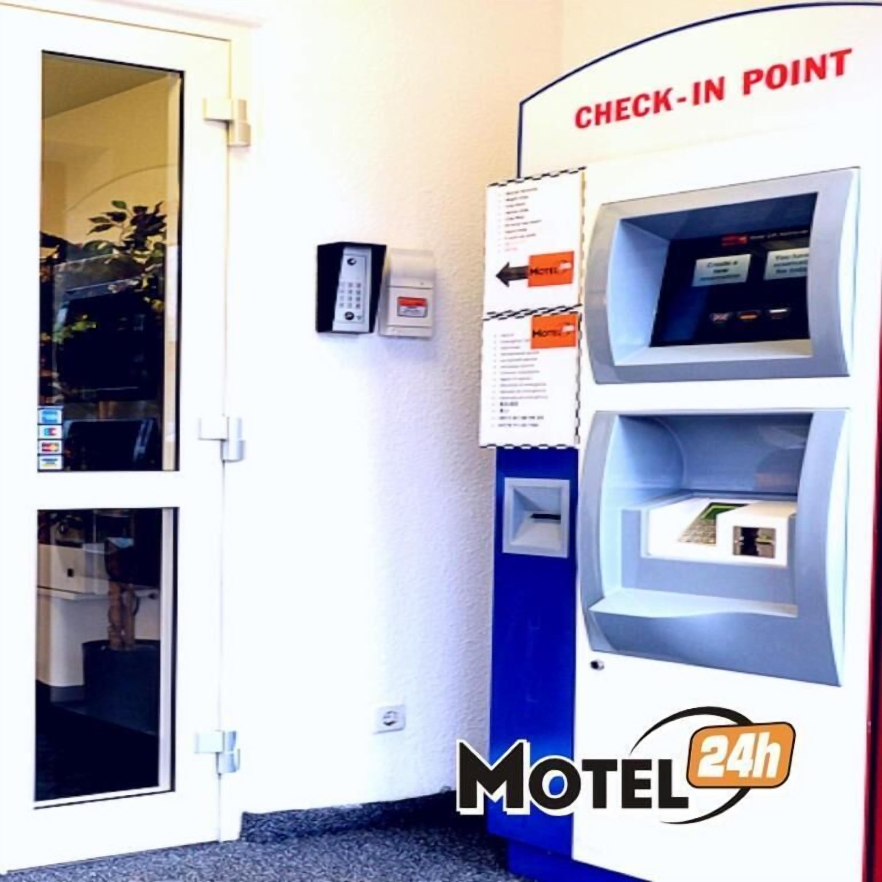 A check-in point at a motel with a keypad and a card reader.