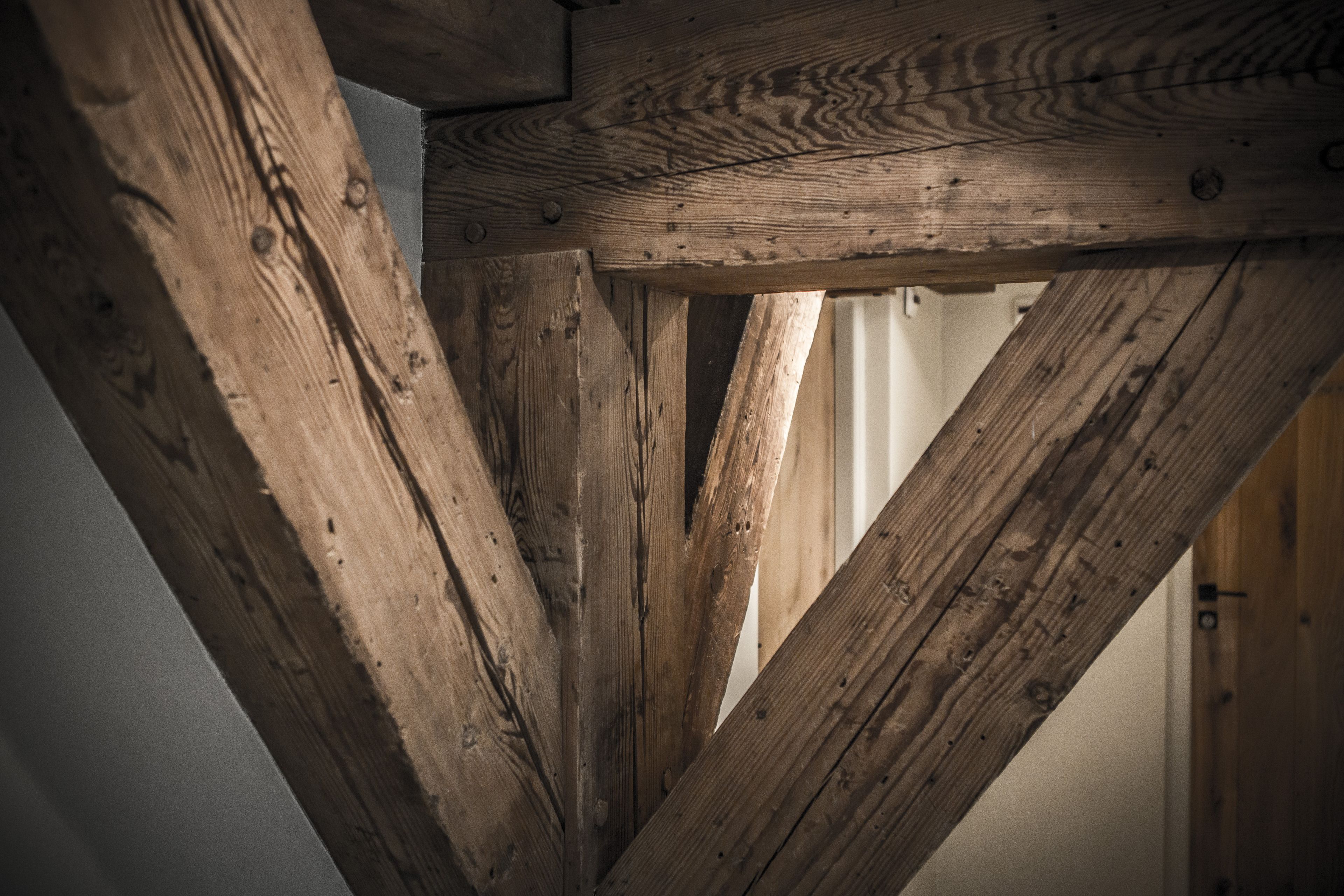 A wooden beam structure, likely part of a building's architecture.