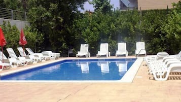 Outdoor pool, pool umbrellas, pool loungers