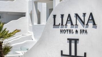 A sign for 'Liana Hotel & Spa' with a stylized 'II' logo.
