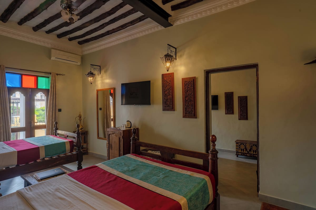 Family Room, Pool view | 1 bedroom, premium bedding, minibar, in-room safe