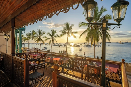 Breakfast, lunch, dinner served; pool views. Mizingani Seafront Hotel