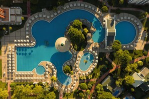 2 outdoor pools, pool umbrellas, pool loungers