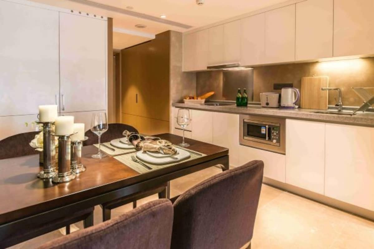 A modern kitchen with a dining area.