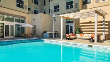 Outdoor pool, open 3:00 PM to 10:00 PM, pool loungers