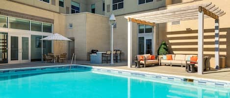 Outdoor pool, open 3:00 PM to 10:00 PM, pool loungers