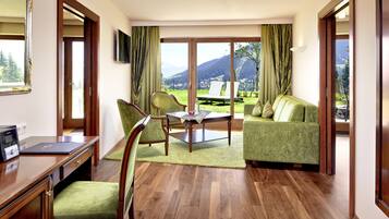 Superior Suite | Living area | Flat-screen TV, iPod dock, first-run movies