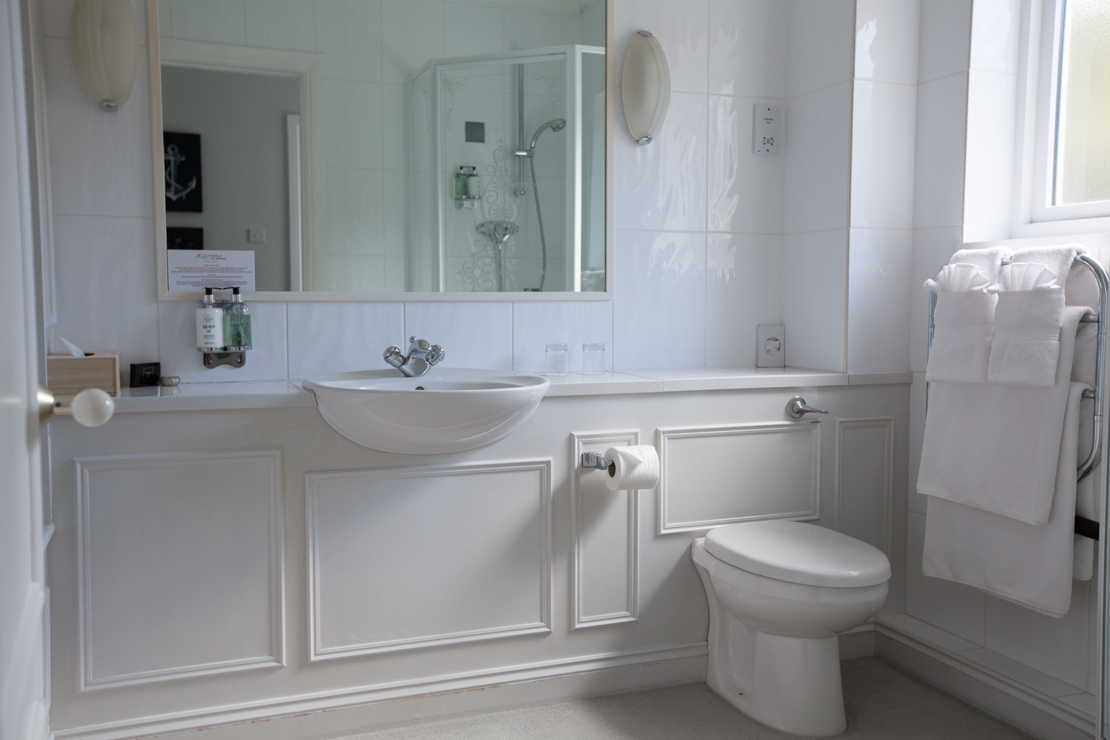 combined shower/bathtub, deep-soaking bathtub, designer toiletries