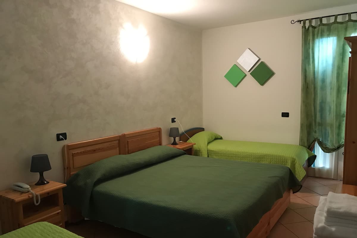 Quadruple Room | Premium bedding, in-room safe, desk, soundproofing
