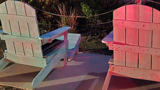 Two Adirondack chairs facing a beach with ocean views. - Sea Scape Oceanfront Motel (Indialantic)