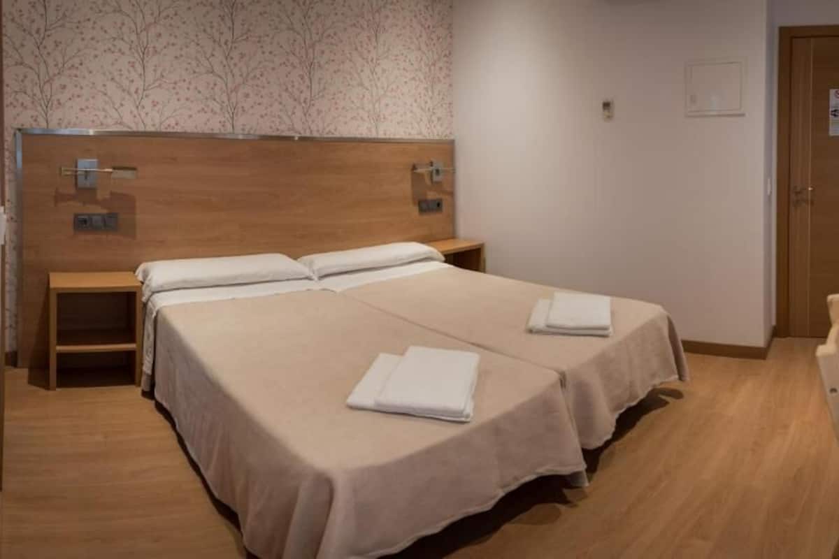 Room with 2 single beds Interior | Desk, blackout drapes, iron/ironing board (on request), WiFi (free)