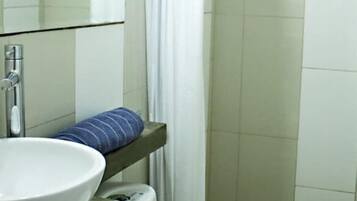 Shower, eco-friendly toiletries, towels, soap