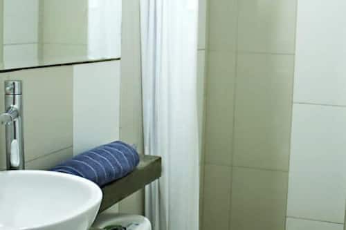 Shower, eco-friendly toiletries, towels, soap