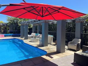 Seasonal outdoor pool, pool loungers
