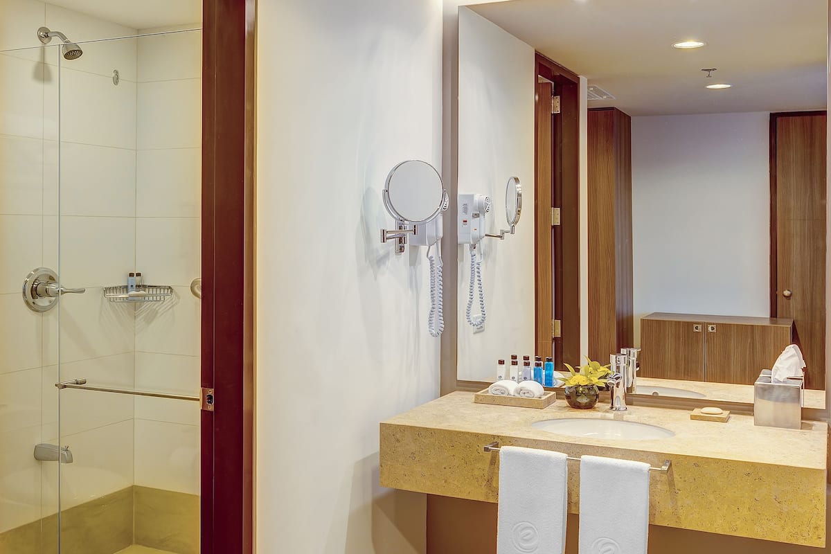 shower, rainfall showerhead, slippers, towels