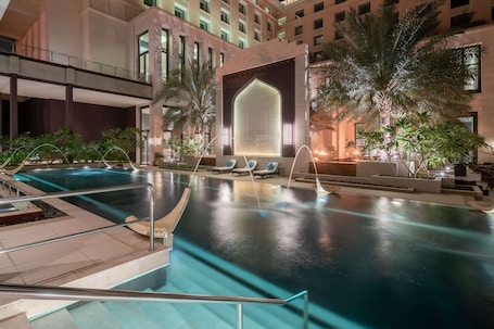 Outdoor pool, sun loungers. Radisson Collection Muscat, Hormuz Grand