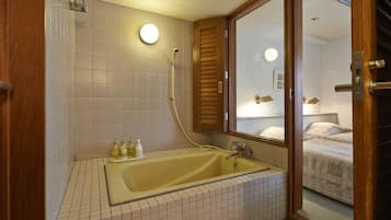 Family Room, In-room bath only (Non-smoking, No pets) | Bathroom | Combined shower/tub, hair dryer, slippers, bidet
