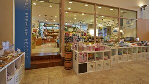 A FUJI PREMIUM RESORT store with a variety of products displayed in the window. - Fuji Premium Resort (Fujikawaguchiko)