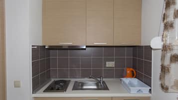 Triple Room, Garden View | Private kitchen | Fridge, coffee/tea maker