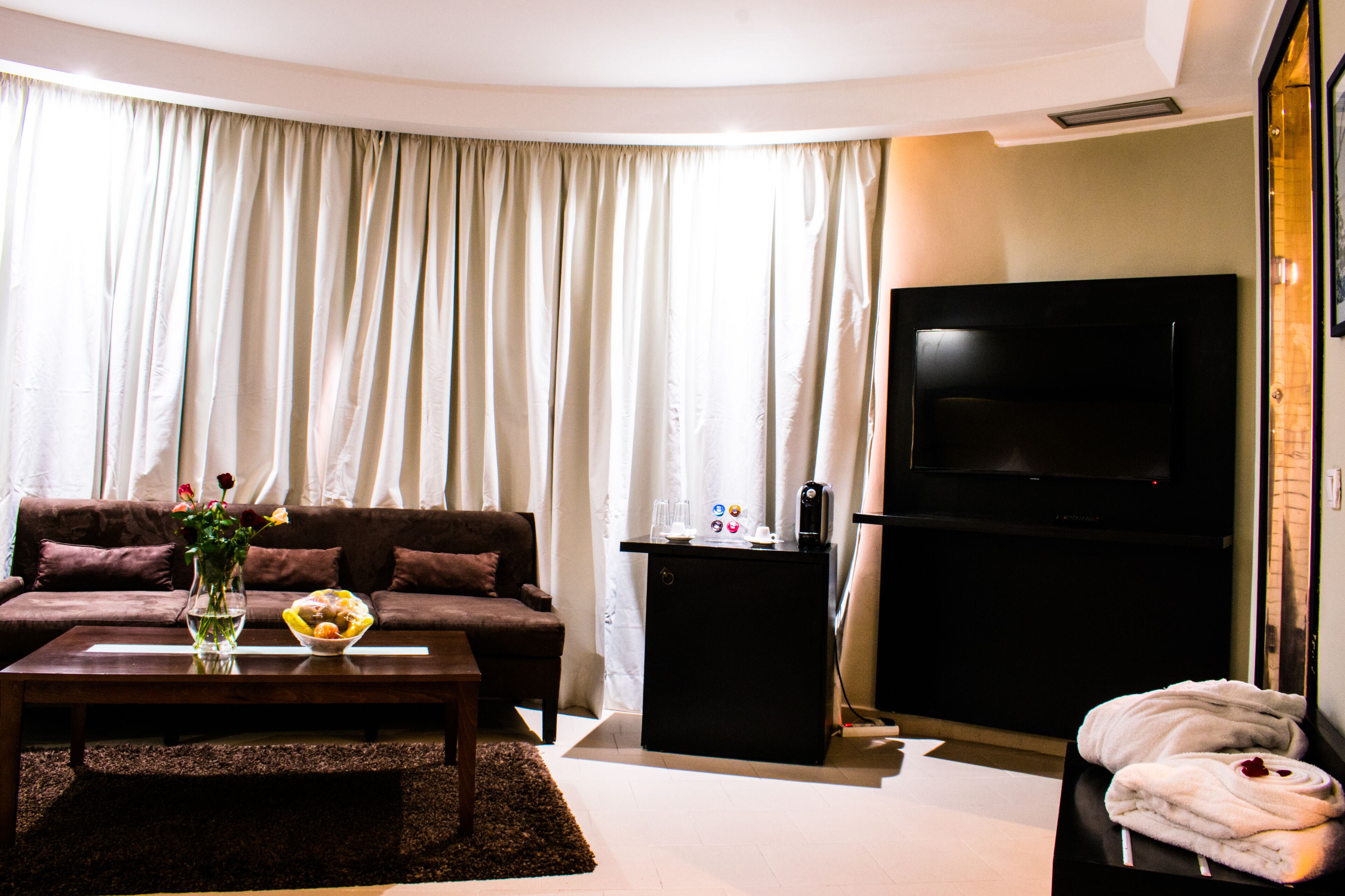 junior suite, private bathroom | living area | plasma tv
